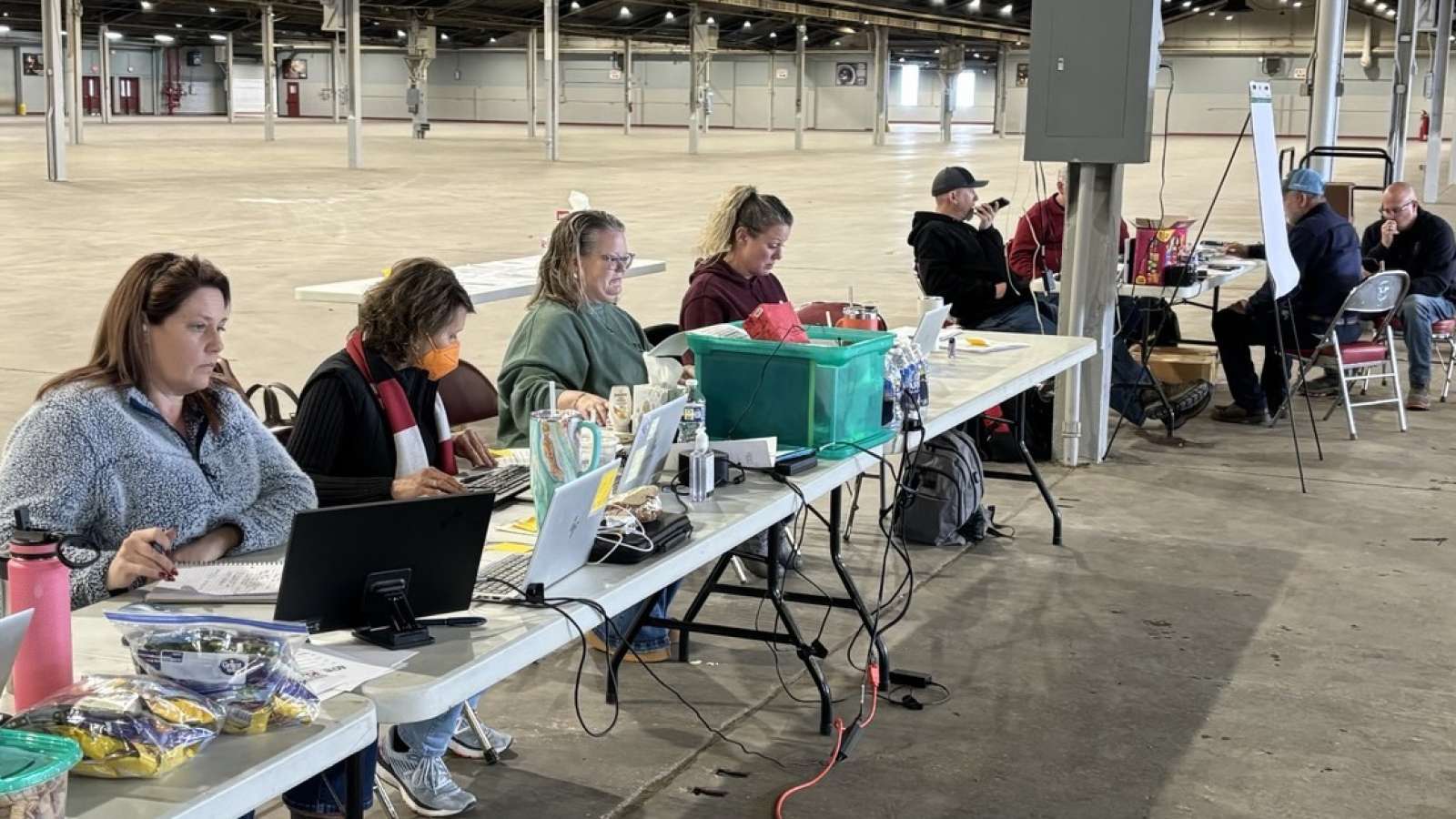 employees at tables with laptops