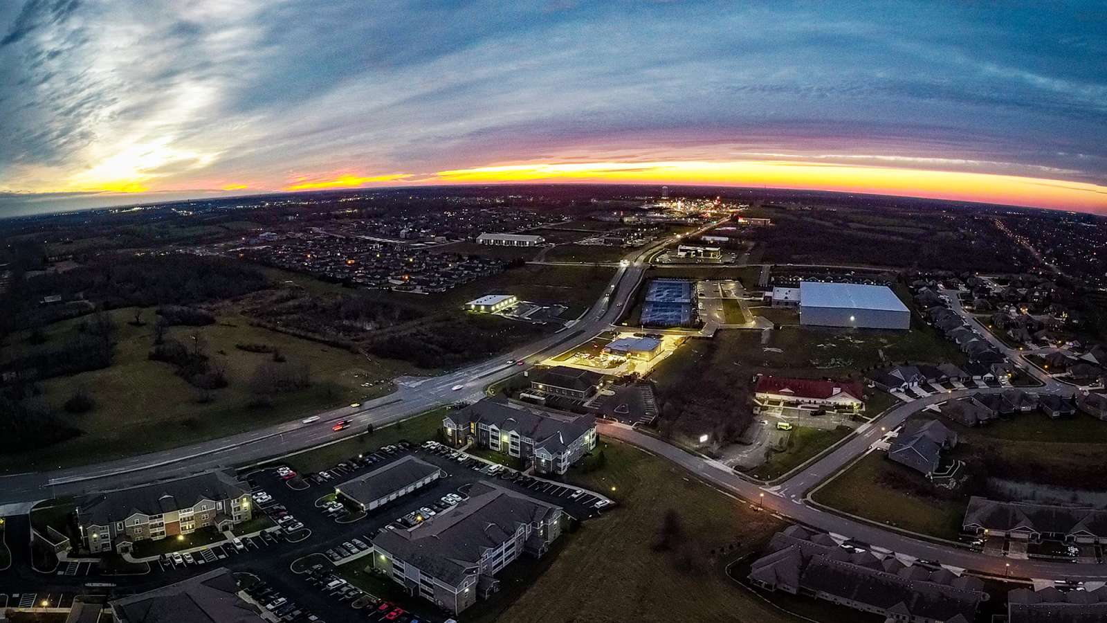 aerial photo of a city at sunset