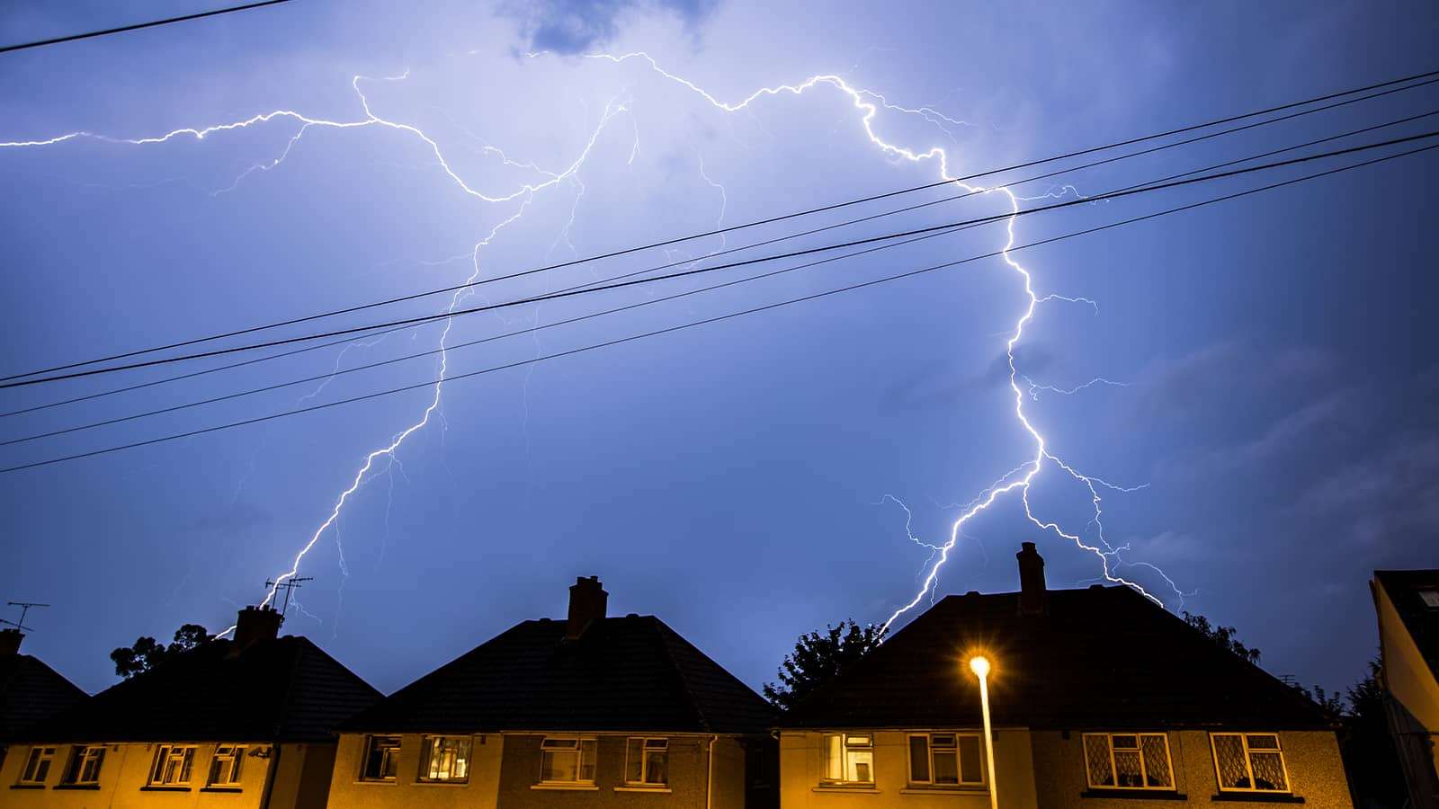 lightning over houses