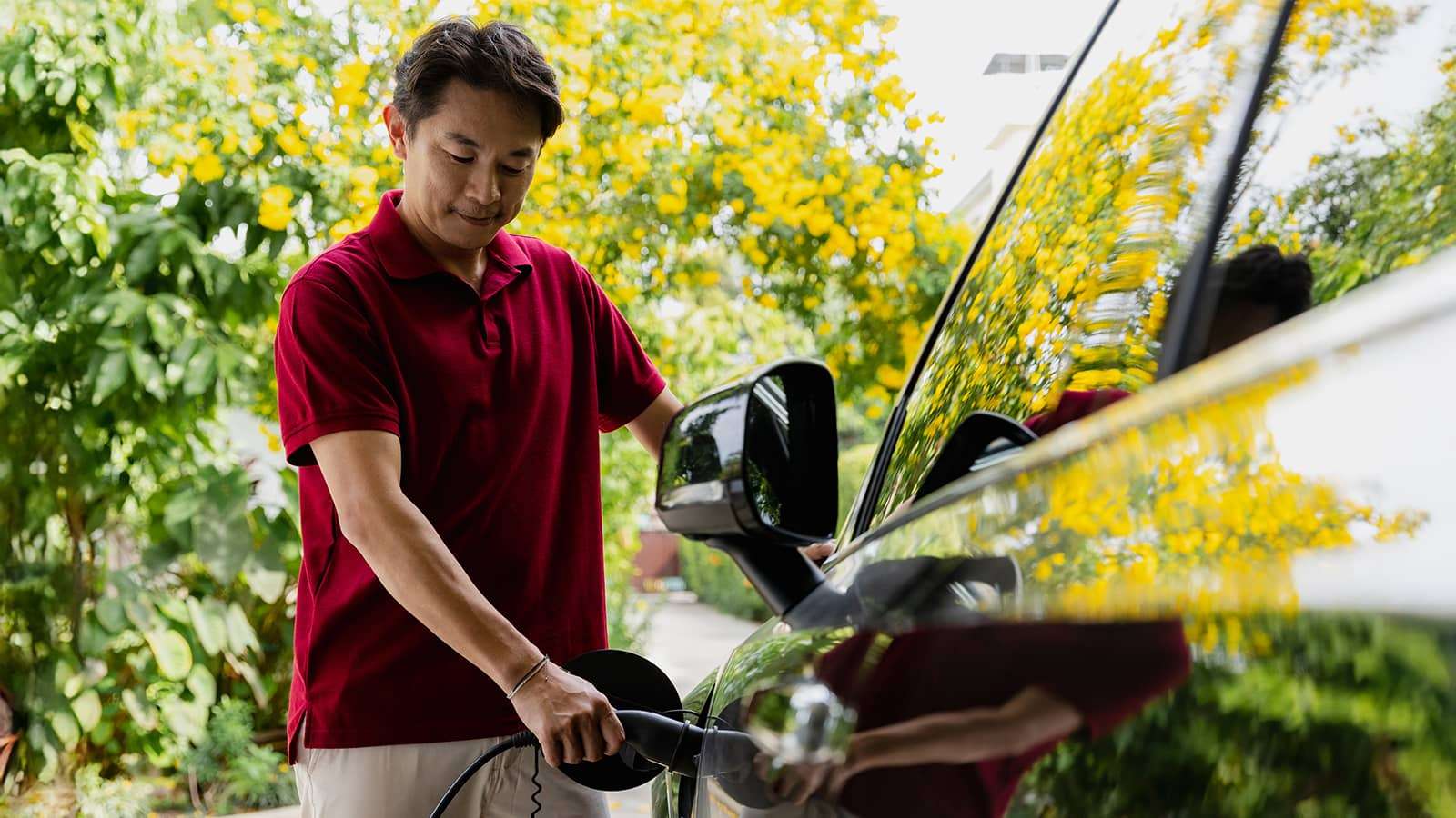 Person charging an EV car