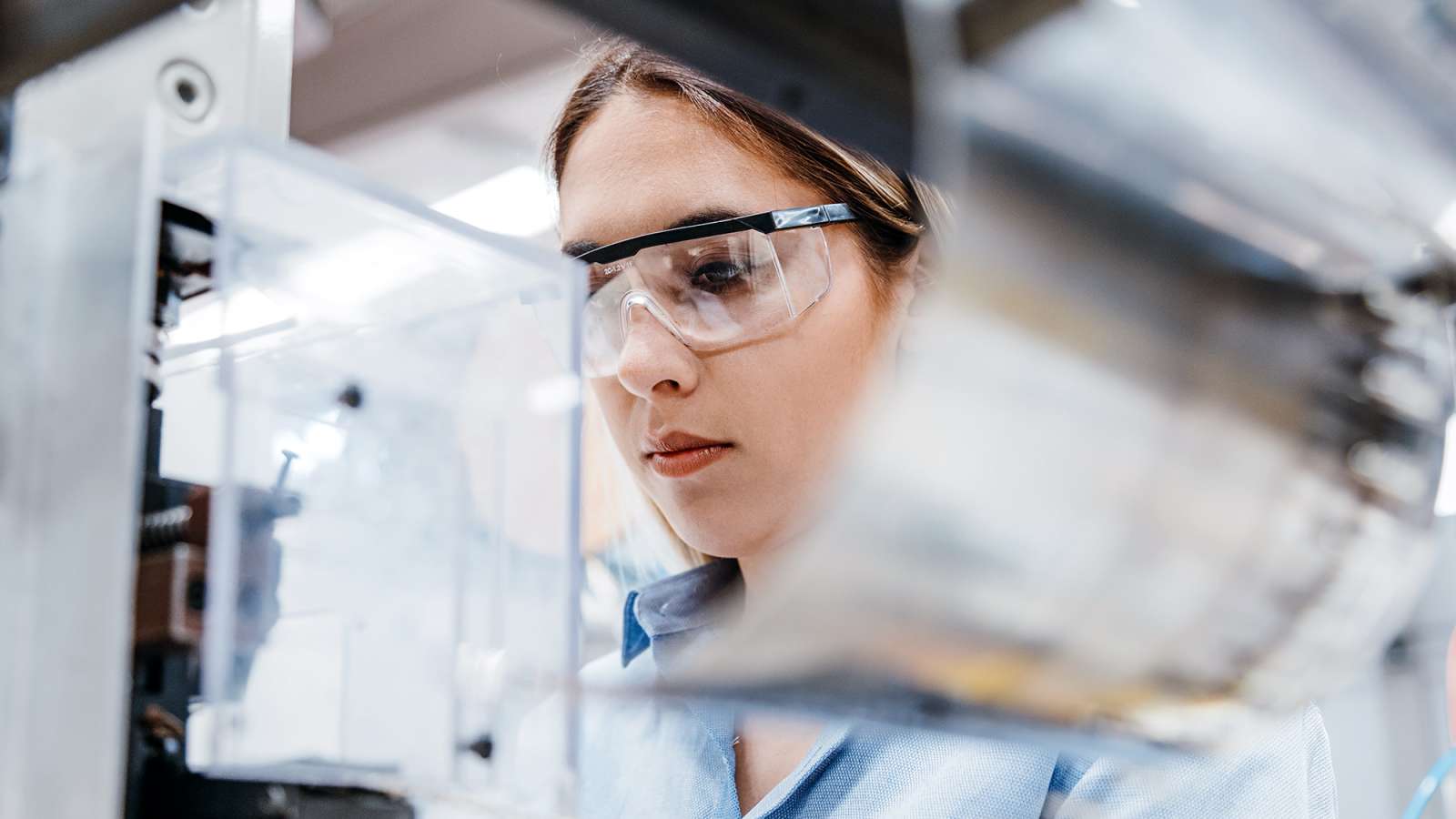 person wearing safety glasses working