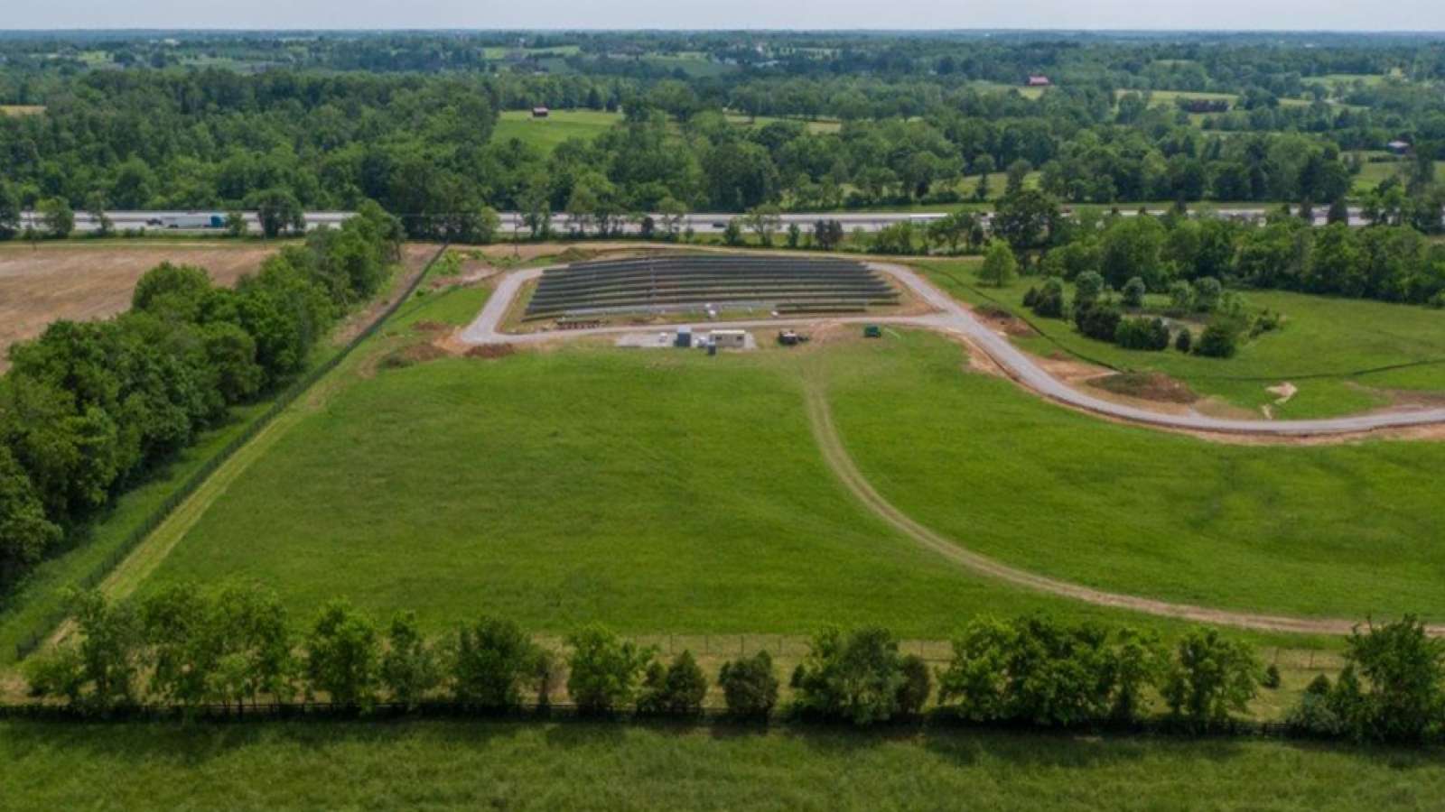 a distant aerial view of the first section of the solar share facility