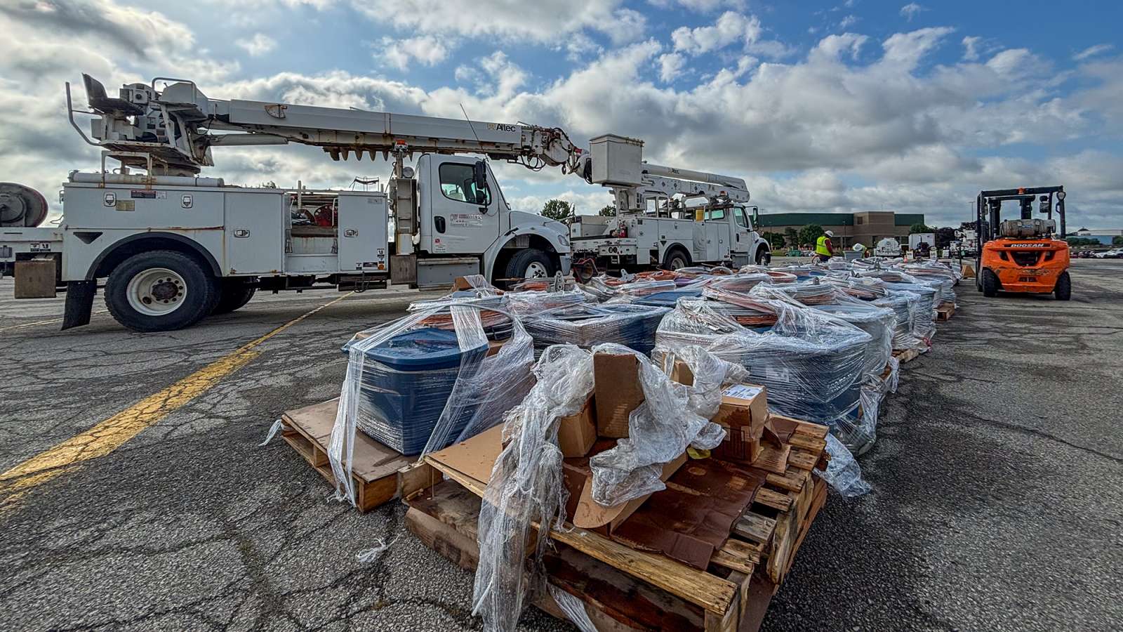 bucket trucks loading up with supplies