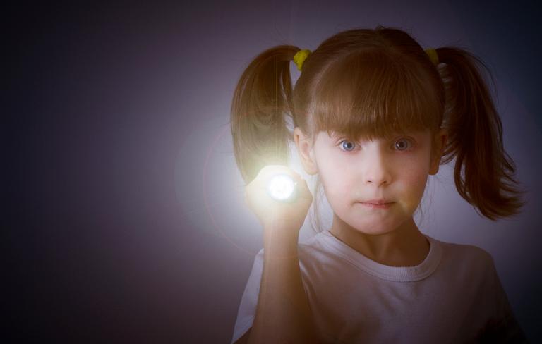 Little girl with flashlight 