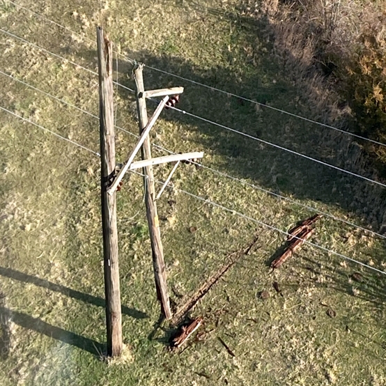broken power pole distribution line