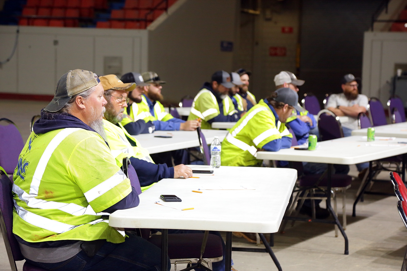 employees at tables discussing restoration plans