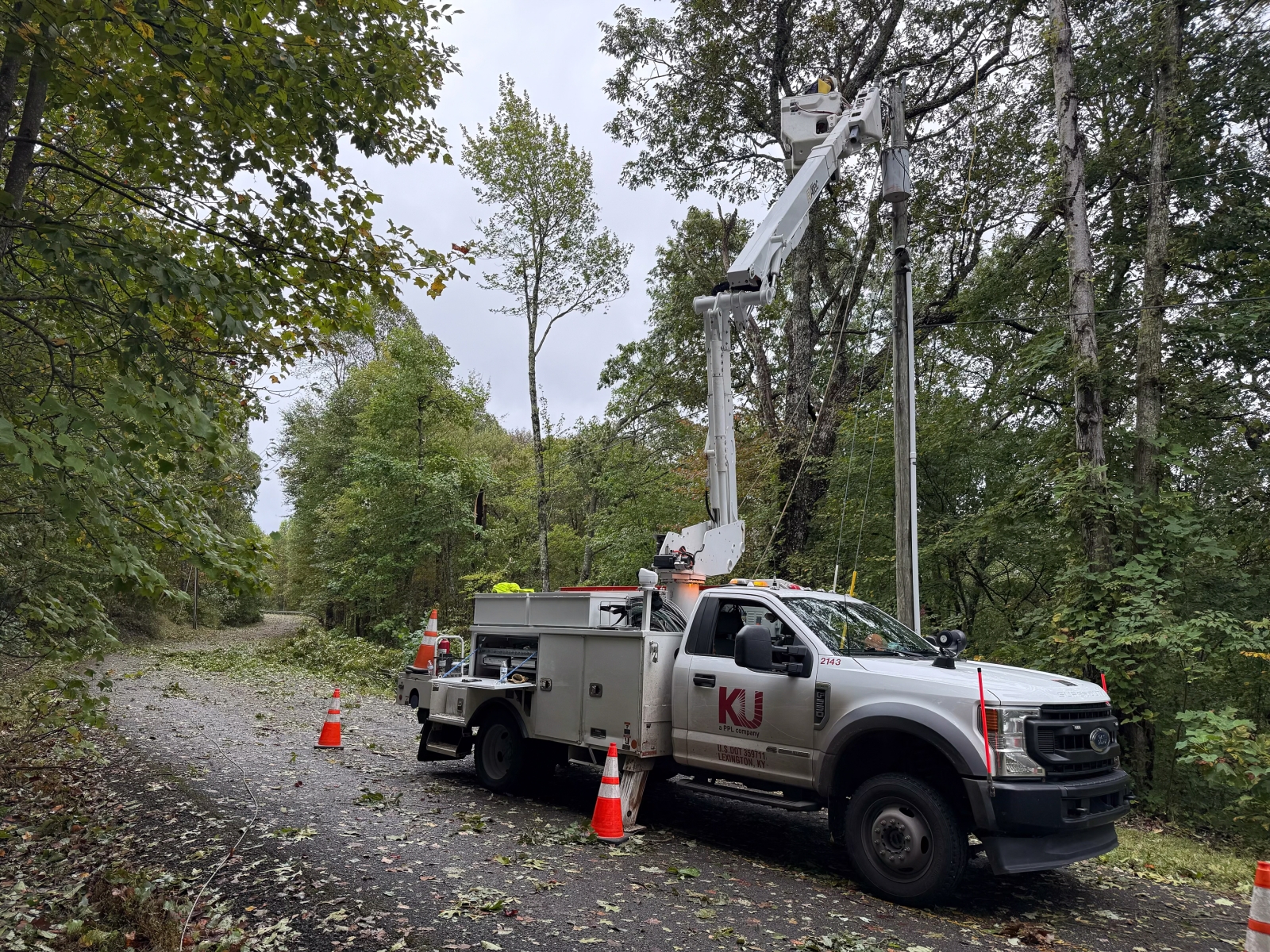 bucket truck extended repairing power line