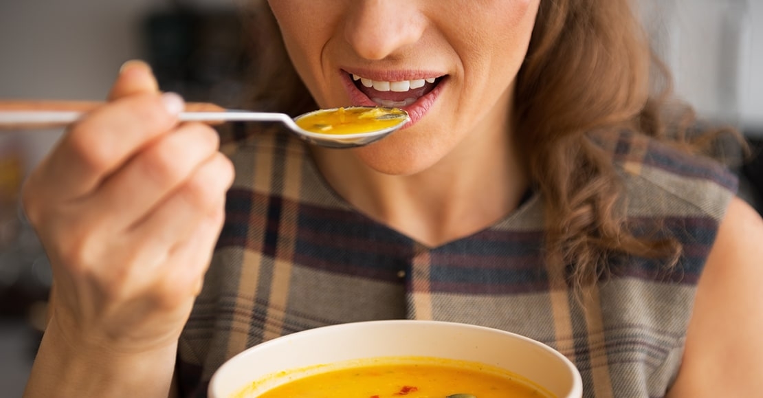 Woman eating tortilla soup