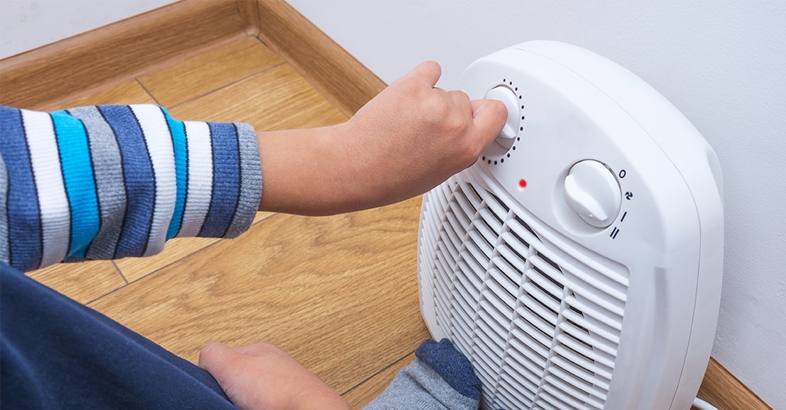 Child turning on space heater